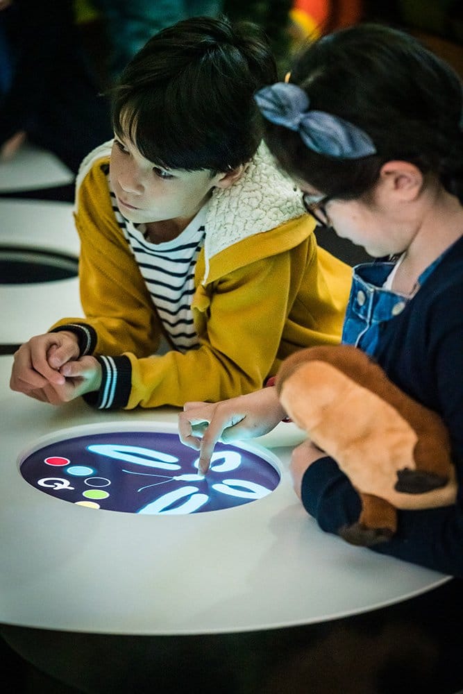 Baby . and Lady AB interact with the activity at the Childrens Gallery